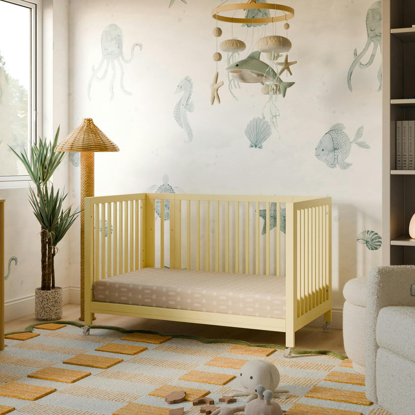 Rolli 9-in-1 Convertible All-Stages® Crib with Bassinet & Toddler Bed Conversion Kits in Pale Yellow