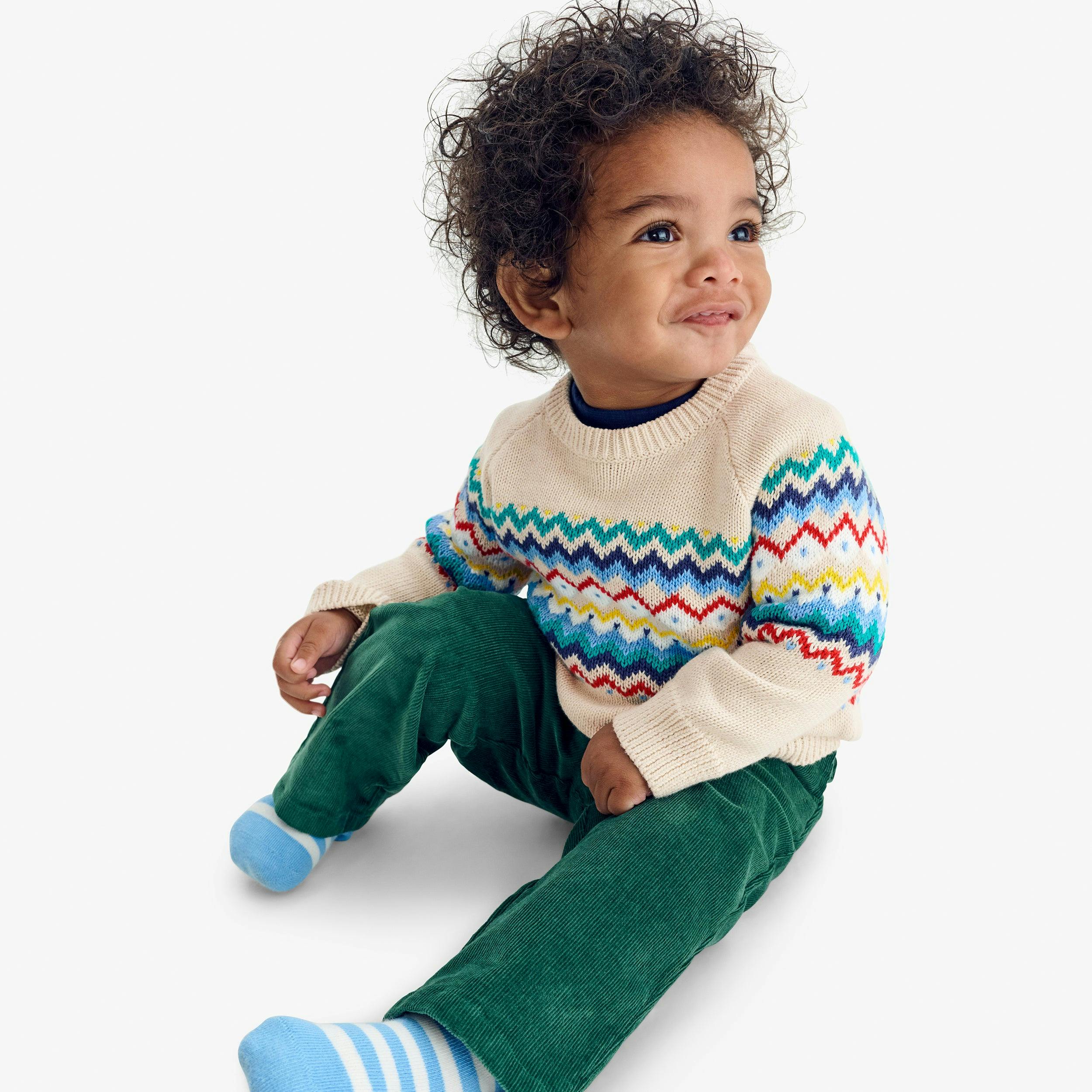 Baby sweater in rainbow fair isle
