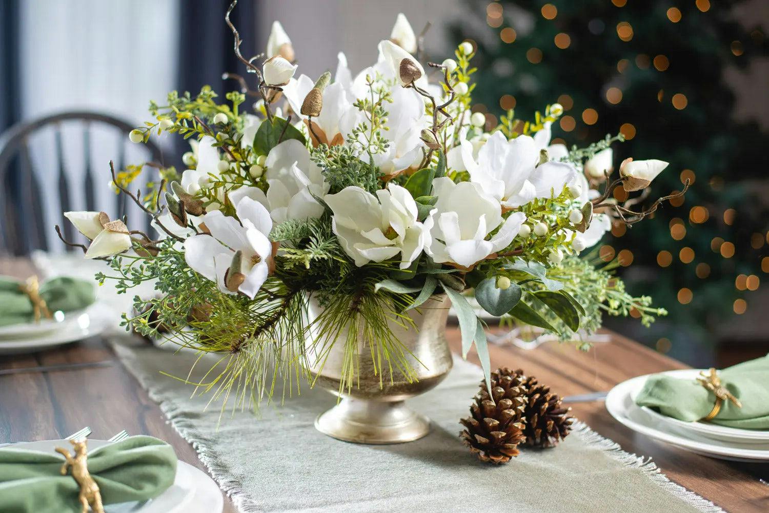 Winter White Magnolia, Pine & Snowberry Christmas Arrangement Centerpiece in Antiqued Silver Metal Urn