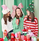 Packed Party Pink Velvet and Bows Santa Hat - Pastel Pink Plush Trim Santa Hat with Festive Bows and Pom Pom for Christmas Parties and Gift Exchanges
