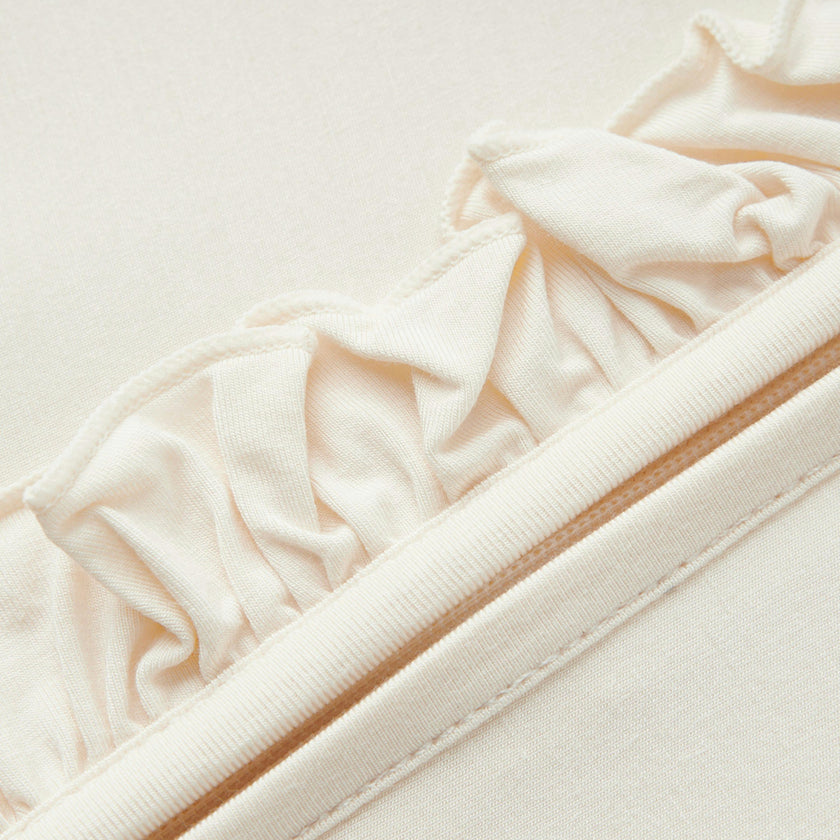 Salt Luxe Solid Ruffle Footed Romper