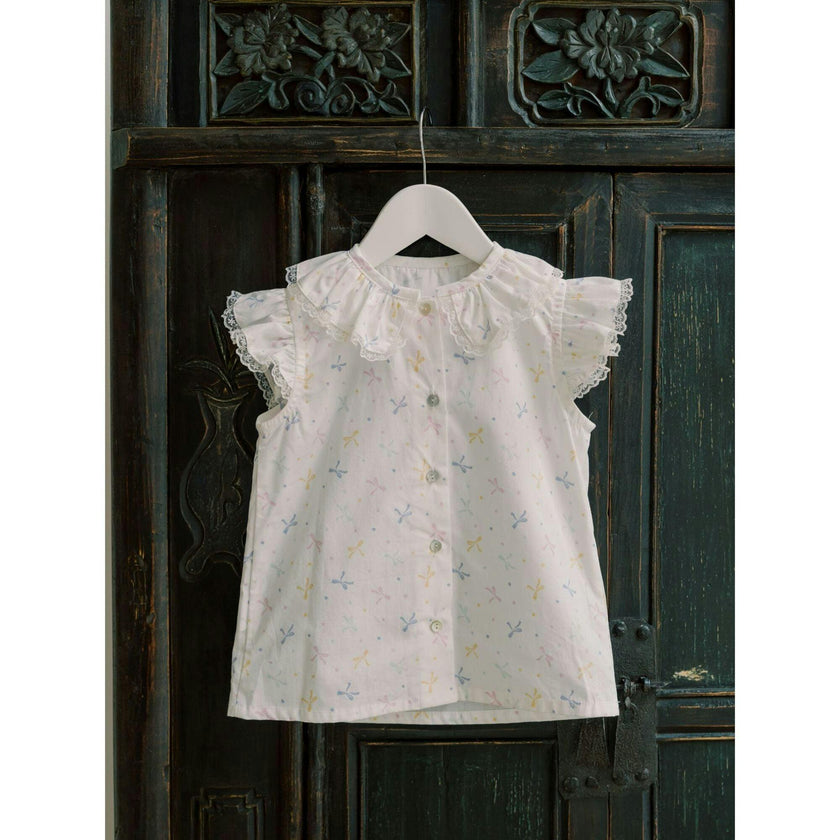 Nicky Hilton x La Coqueta Ivory Bow Olivia Girl Shirt