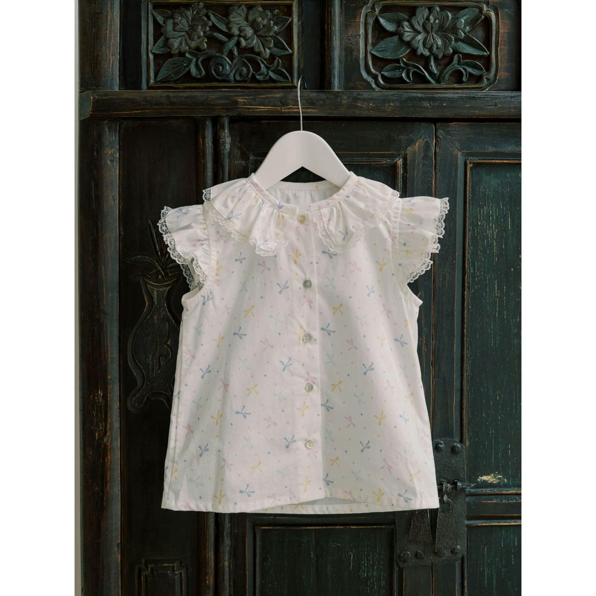 Nicky Hilton x La Coqueta Ivory Bow Olivia Girl Shirt