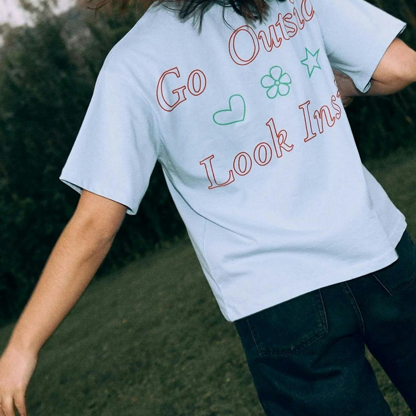 women's t-shirt – go outside look inside
