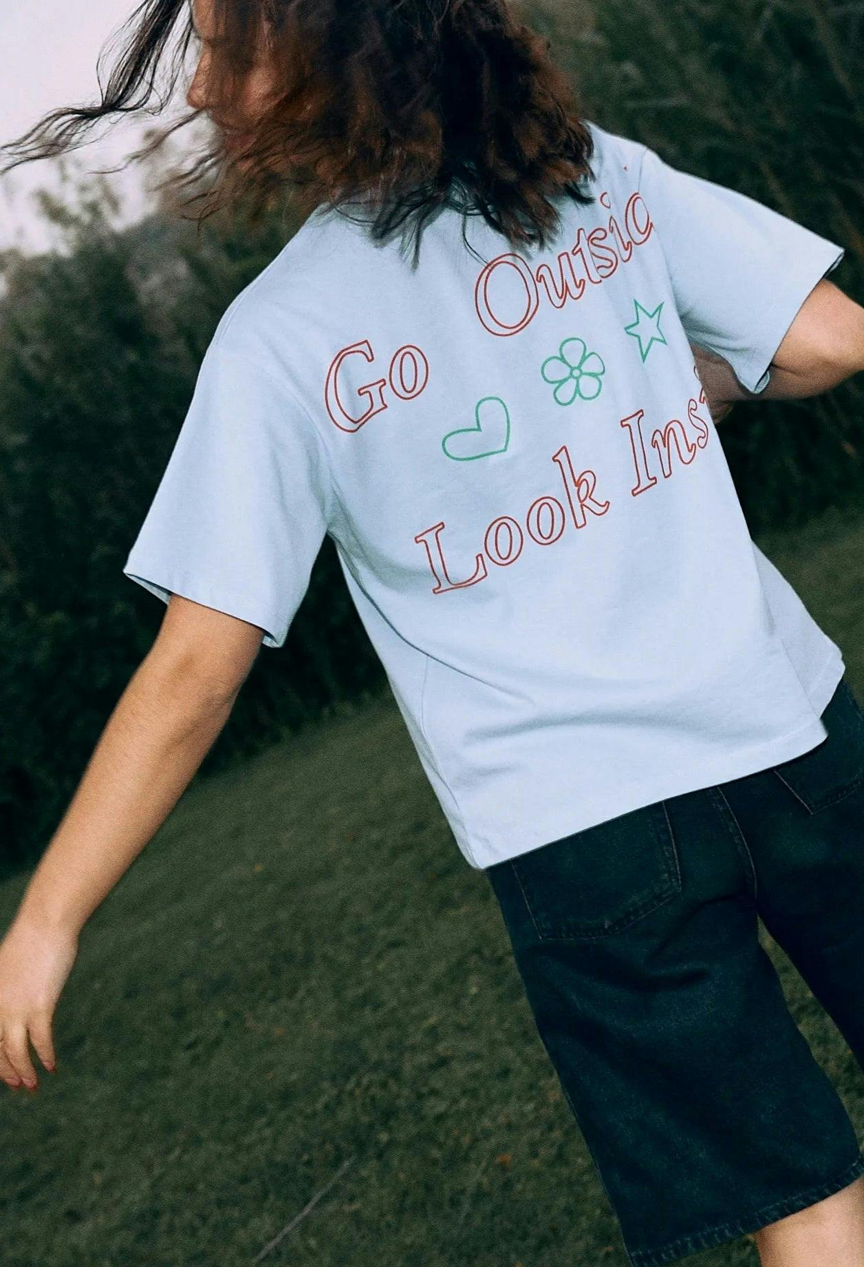 women's t-shirt – go outside look inside