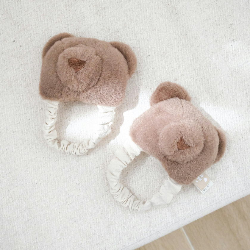 Teddy kicking rattle