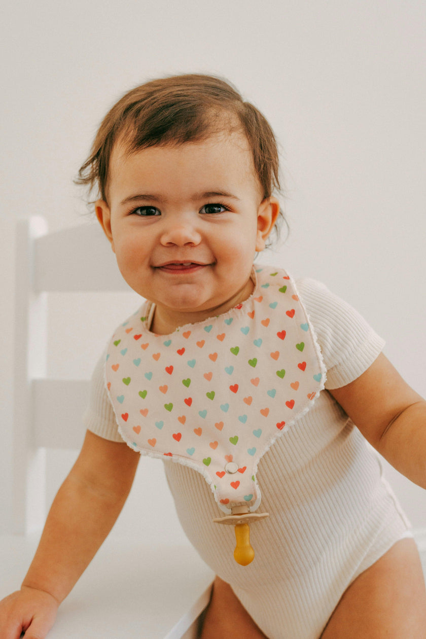 Soothe & Snap Pacifier Bib | Sweetheart Parade