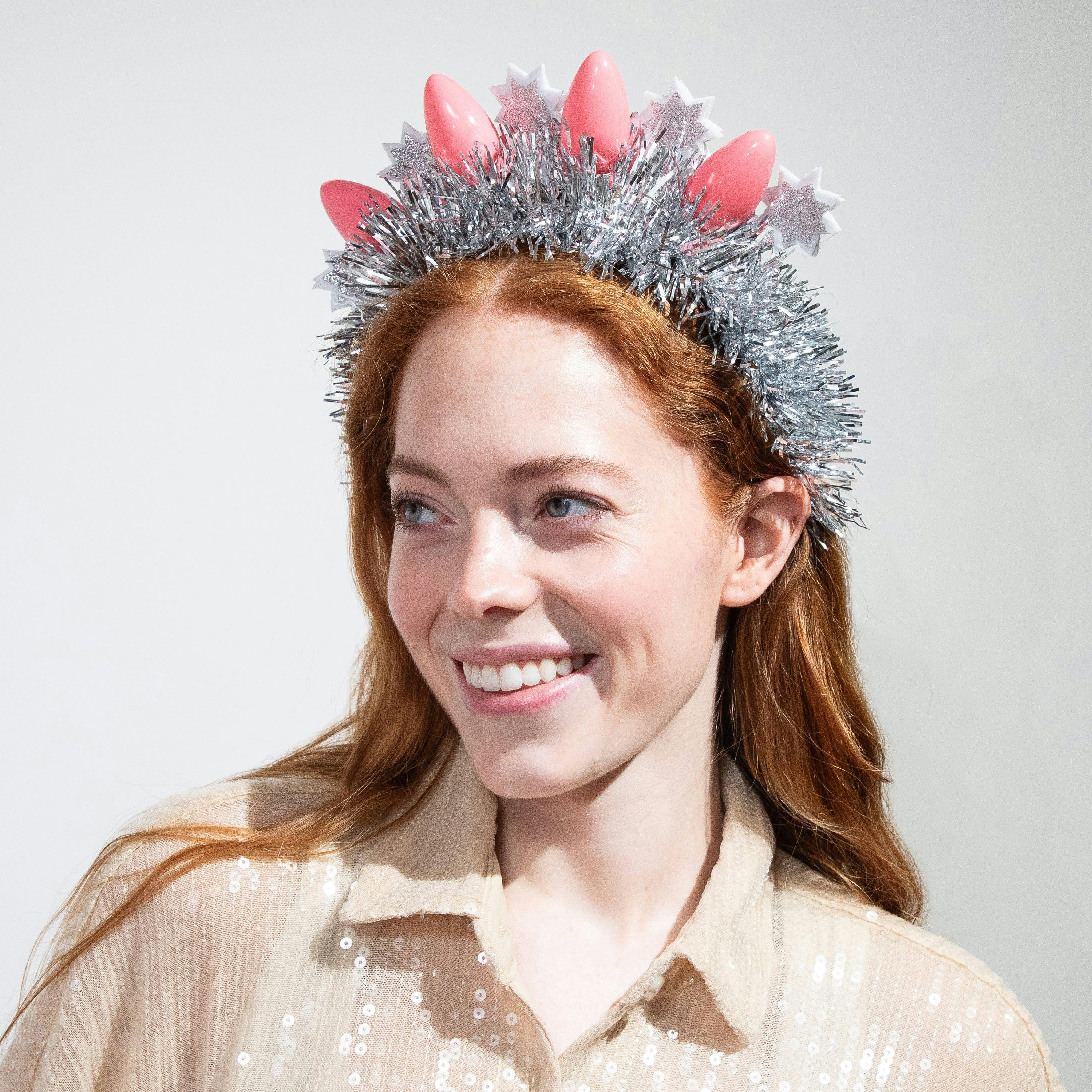 Packed Party Tinsel Topper Christmas Light Novelty Headband - Silver Tinsel with Pink Christmas Lights and Silver Glitter Stars for Holiday Parties, One Size