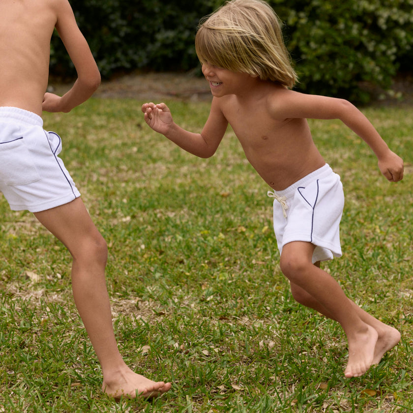 boys white french terry short with navy side piping