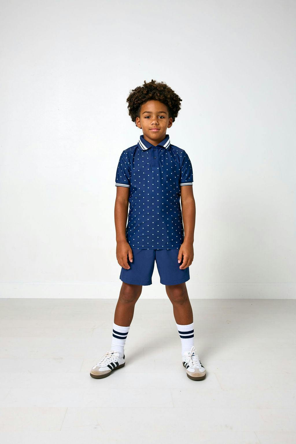 navy polka dot polo shirt