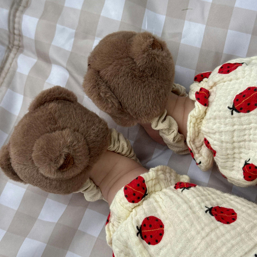 Teddy kicking rattle