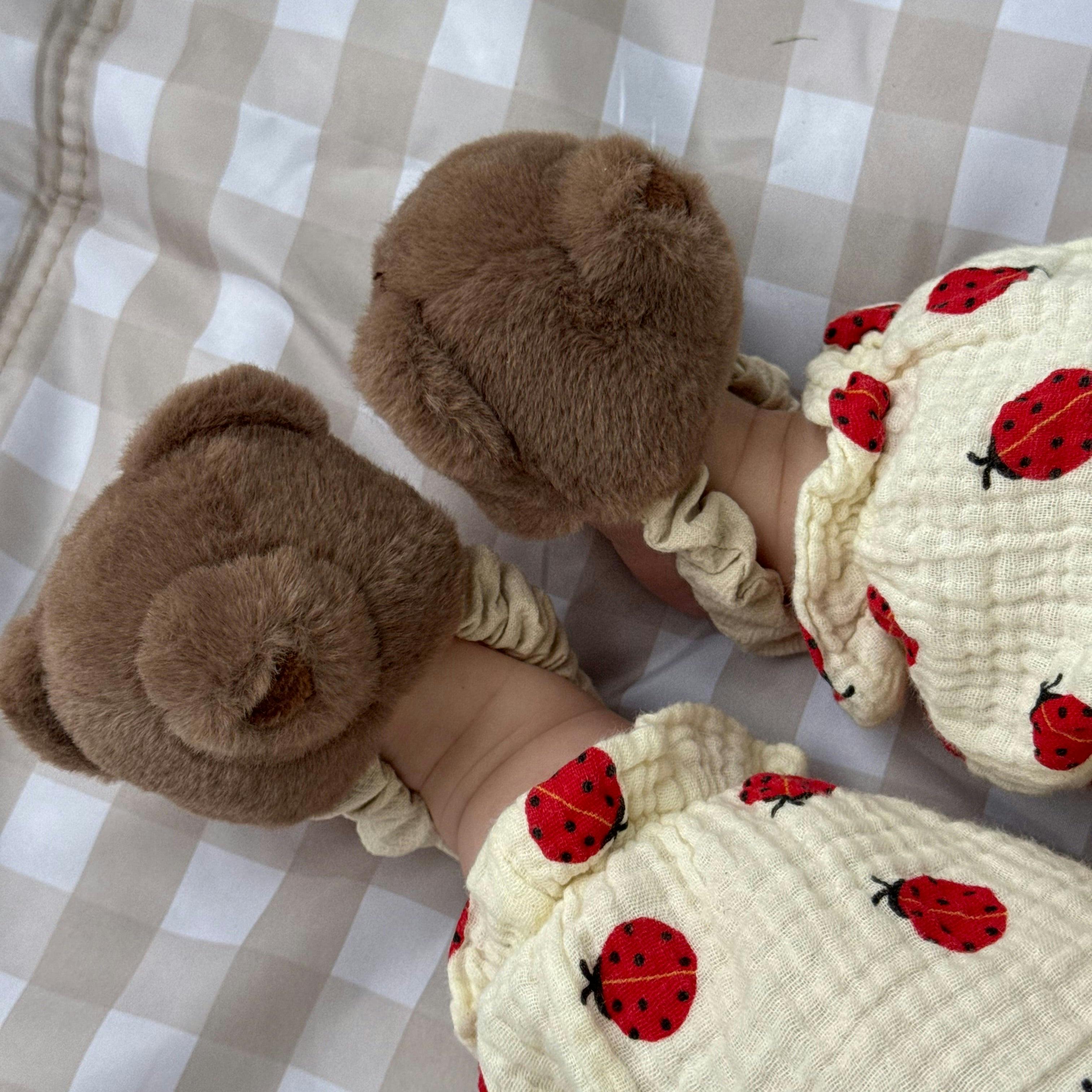 Teddy kicking rattle