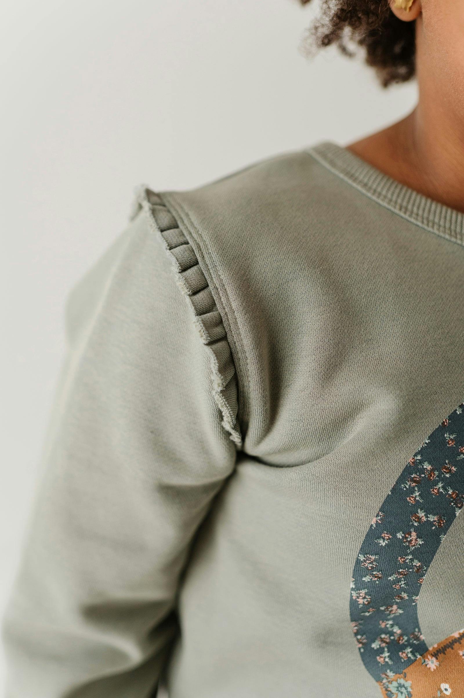 Girls Raw Edge Sweatshirt in Patchwork Peace Sign