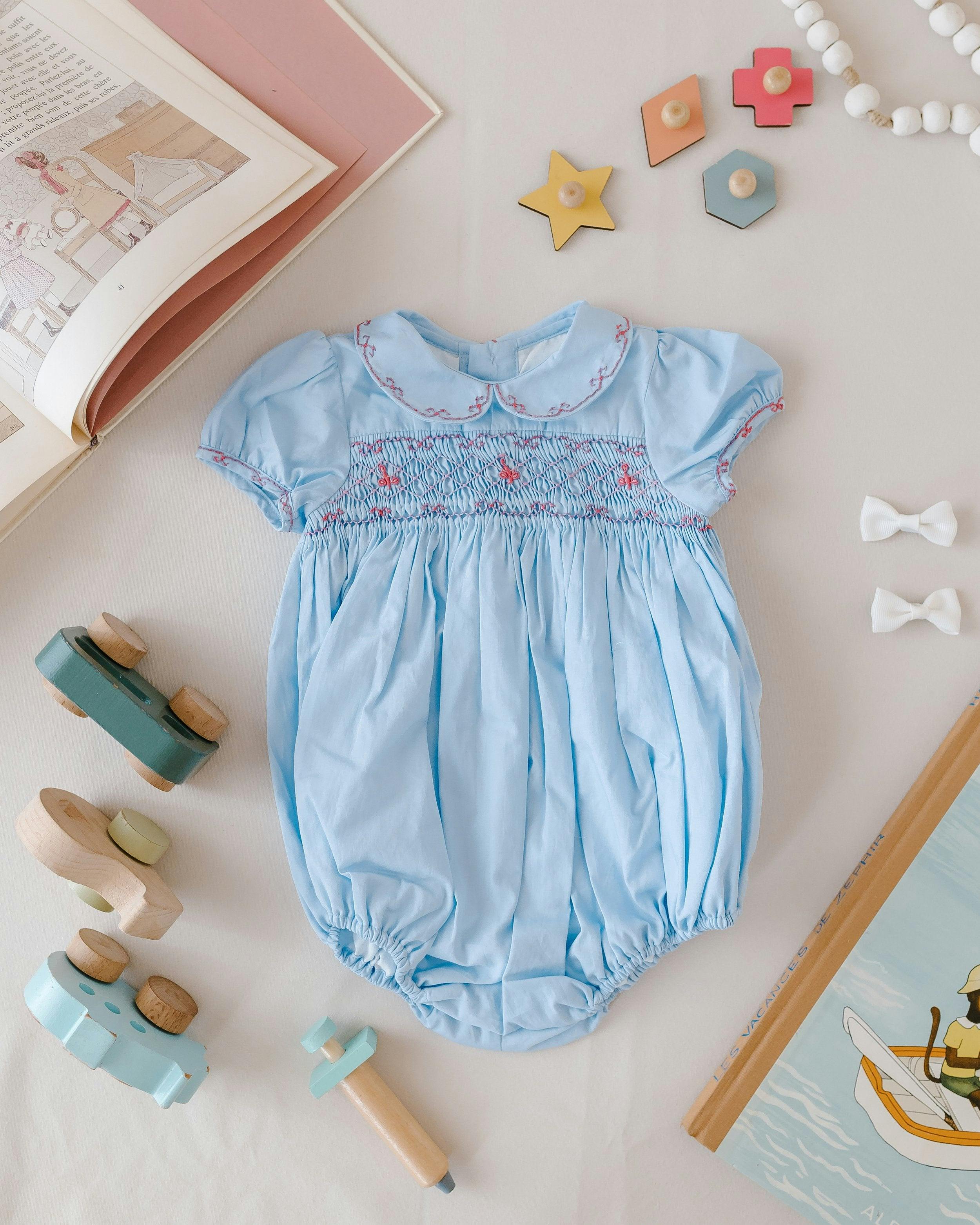 Princess Charlotte Sky Blue Smocked Baby Romper