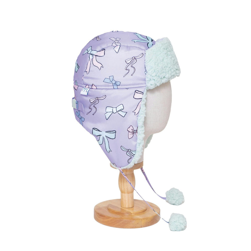 The Cozy Trapper Hat – Bows Print with Pale Aqua Sherpa Liner & Pompoms