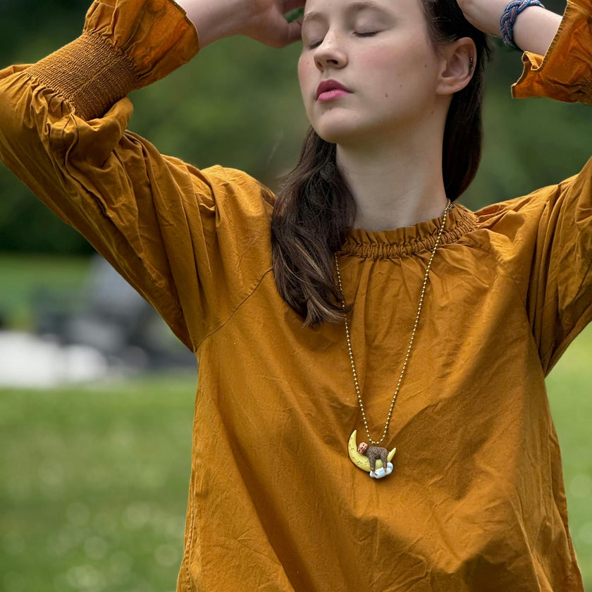 GLOW-IN-THE-DARK SLEEPY SLOTH NECKLACE