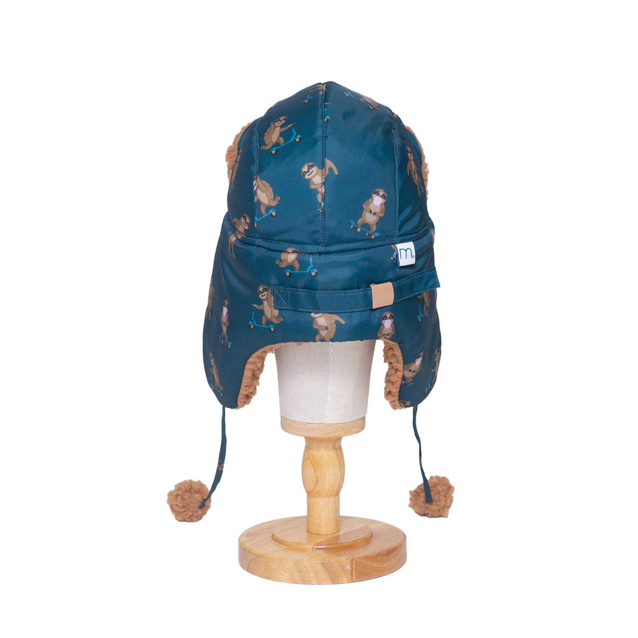 The Cozy Trapper Hat – Skating Sloths Print with Curry Tan Sherpa Liner & Pompoms