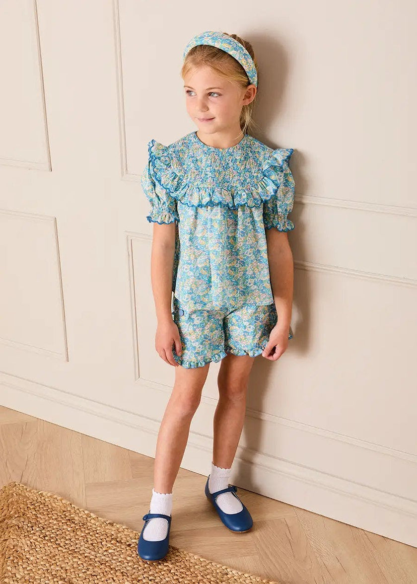Leontyne Floral Scalloped Smocked Detail Short Sleeve Blouse in Blue Made with Liberty Fabric (2- 10yrs)