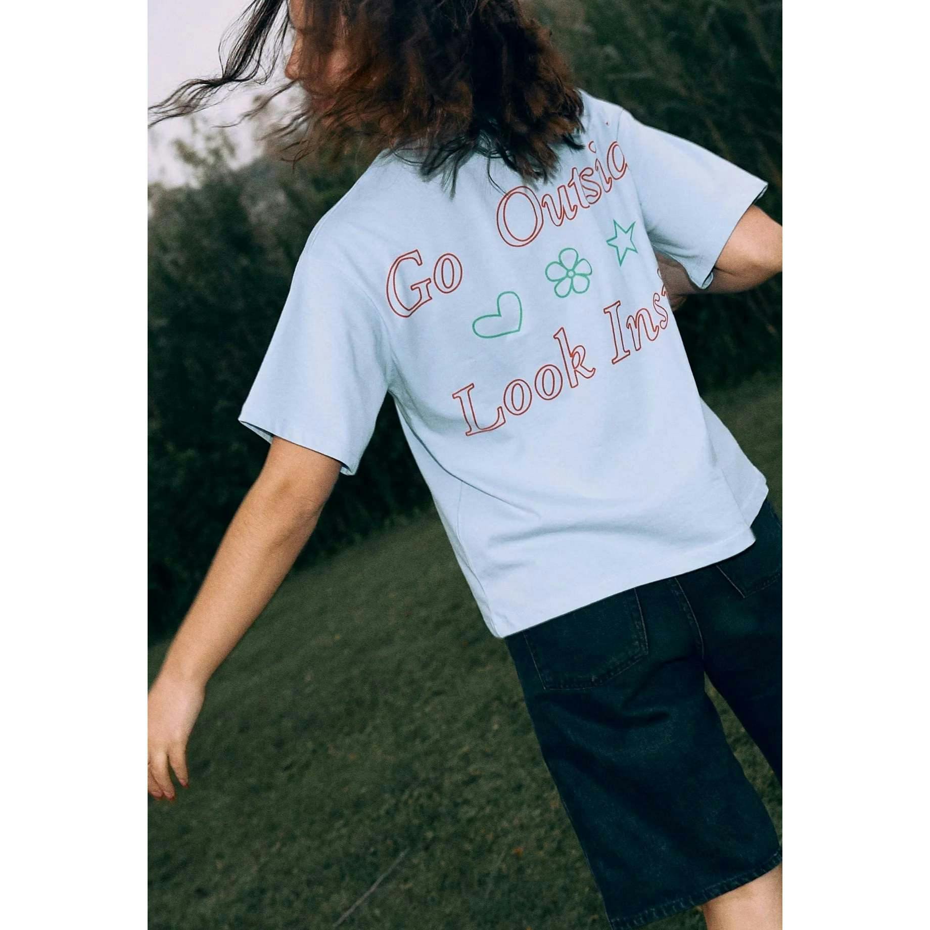 women's t-shirt – go outside look inside