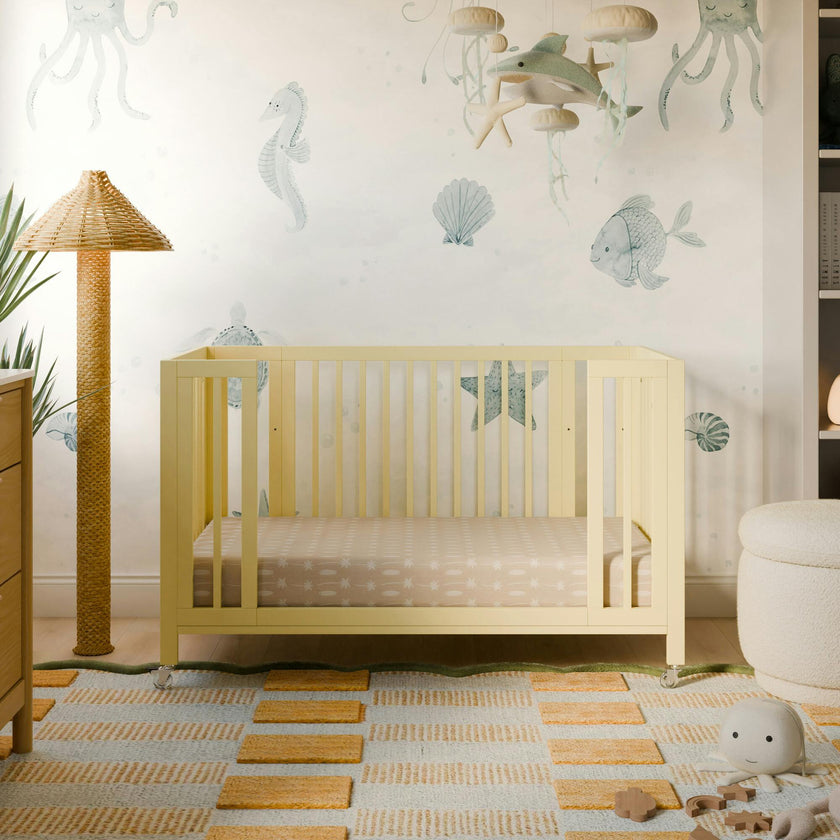 Rolli 9-in-1 Convertible All-Stages® Crib with Bassinet & Toddler Bed Conversion Kits in Pale Yellow