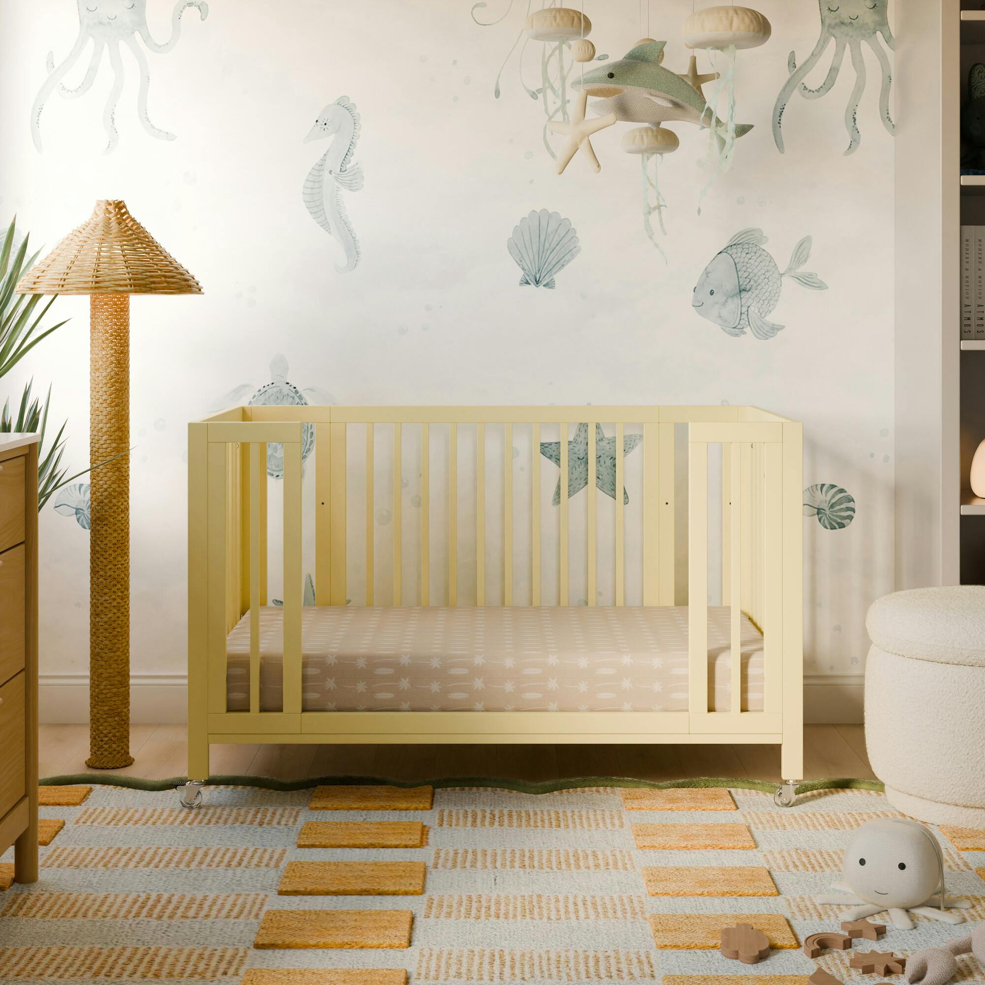 Rolli 9-in-1 Convertible All-Stages® Crib with Bassinet & Toddler Bed Conversion Kits in Pale Yellow