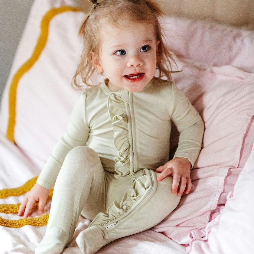 Aloe Luxe Solid Ruffle Footed Romper