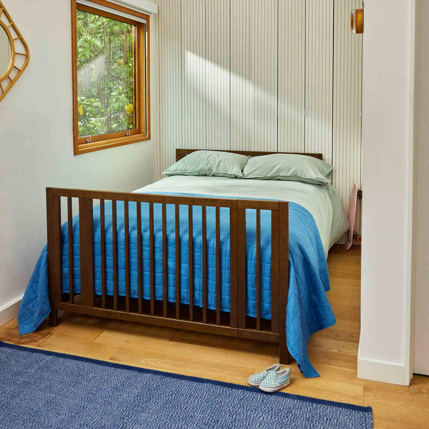 Rolli 9-in-1 Convertible All-Stages® Crib with Bassinet & Toddler Bed Conversion Kits in Natural Walnut