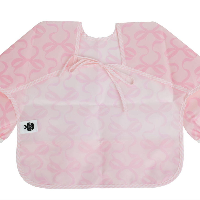The Cover Everything Bib in Bows on Pink