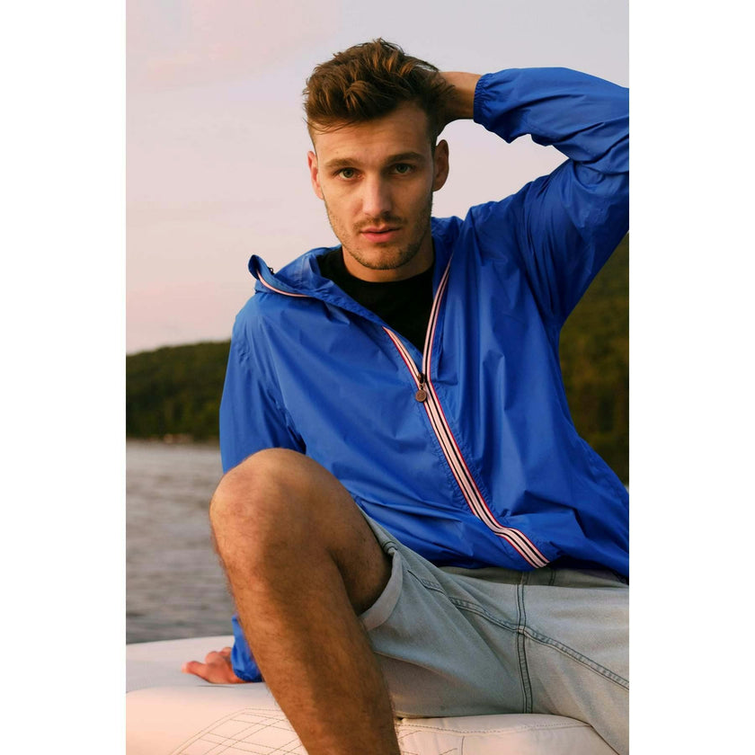 Women's royal blue full zip packable rain jacket and windbreaker