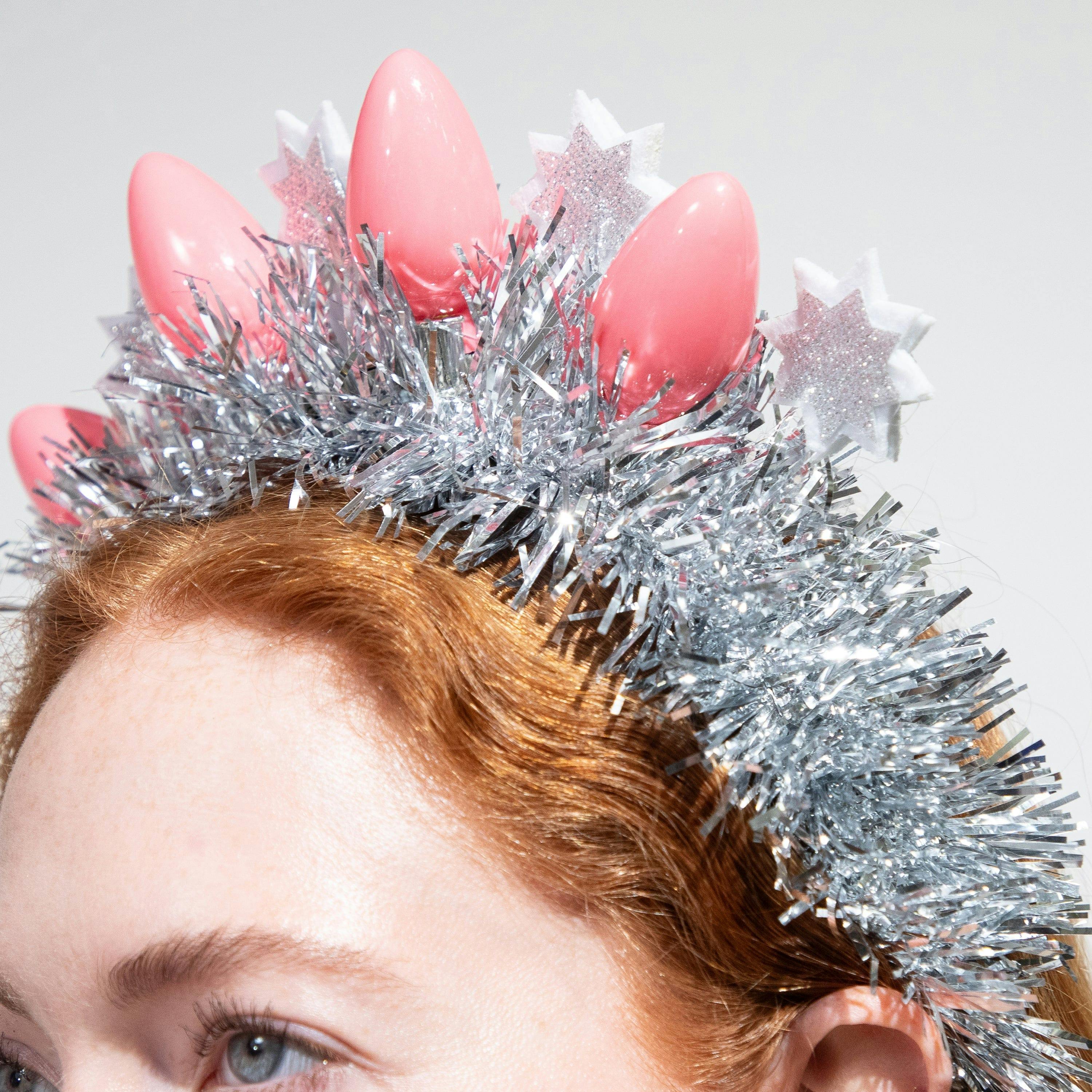 Packed Party Tinsel Topper Christmas Light Novelty Headband - Silver Tinsel with Pink Christmas Lights and Silver Glitter Stars for Holiday Parties, One Size