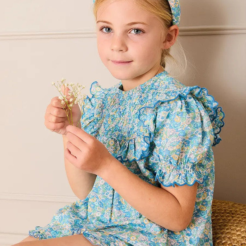 Leontyne Floral Scalloped Smocked Detail Short Sleeve Blouse in Blue Made with Liberty Fabric (2- 10yrs)