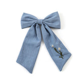 Halo Luxe Felicity Summer Soiree Linen Floral Embroidered Bow Hair Clip - Light Blue / White