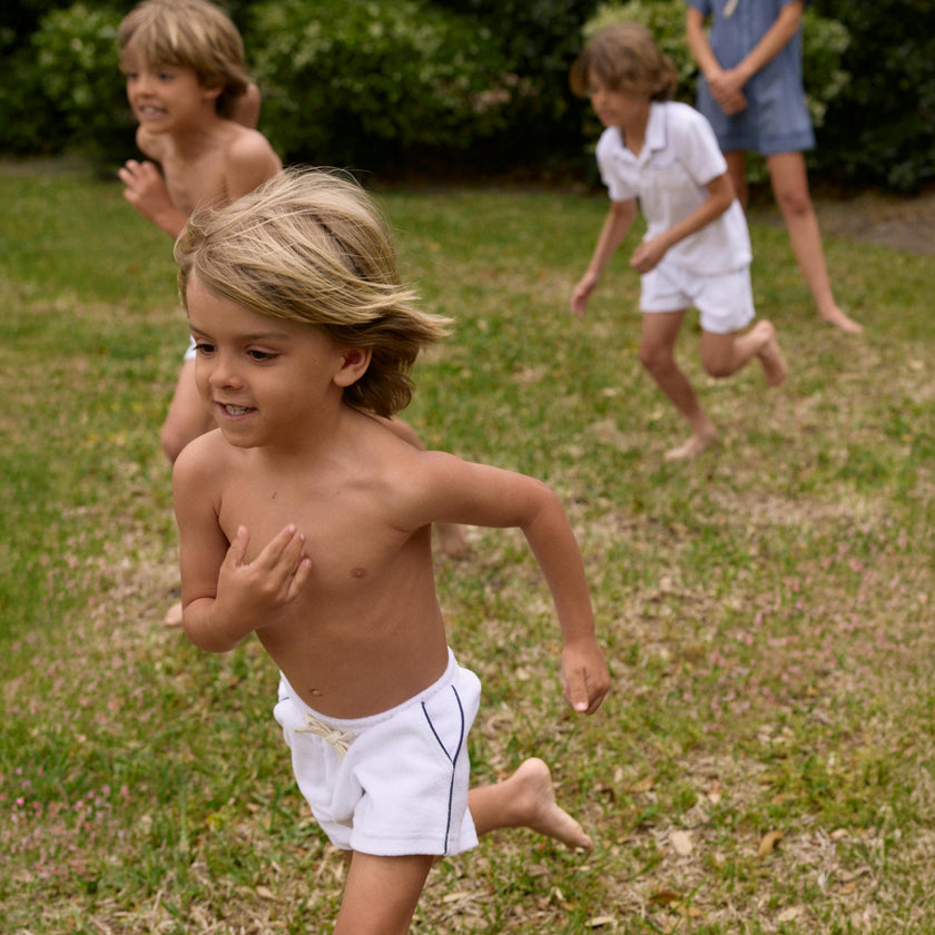 boys white french terry short with navy side piping