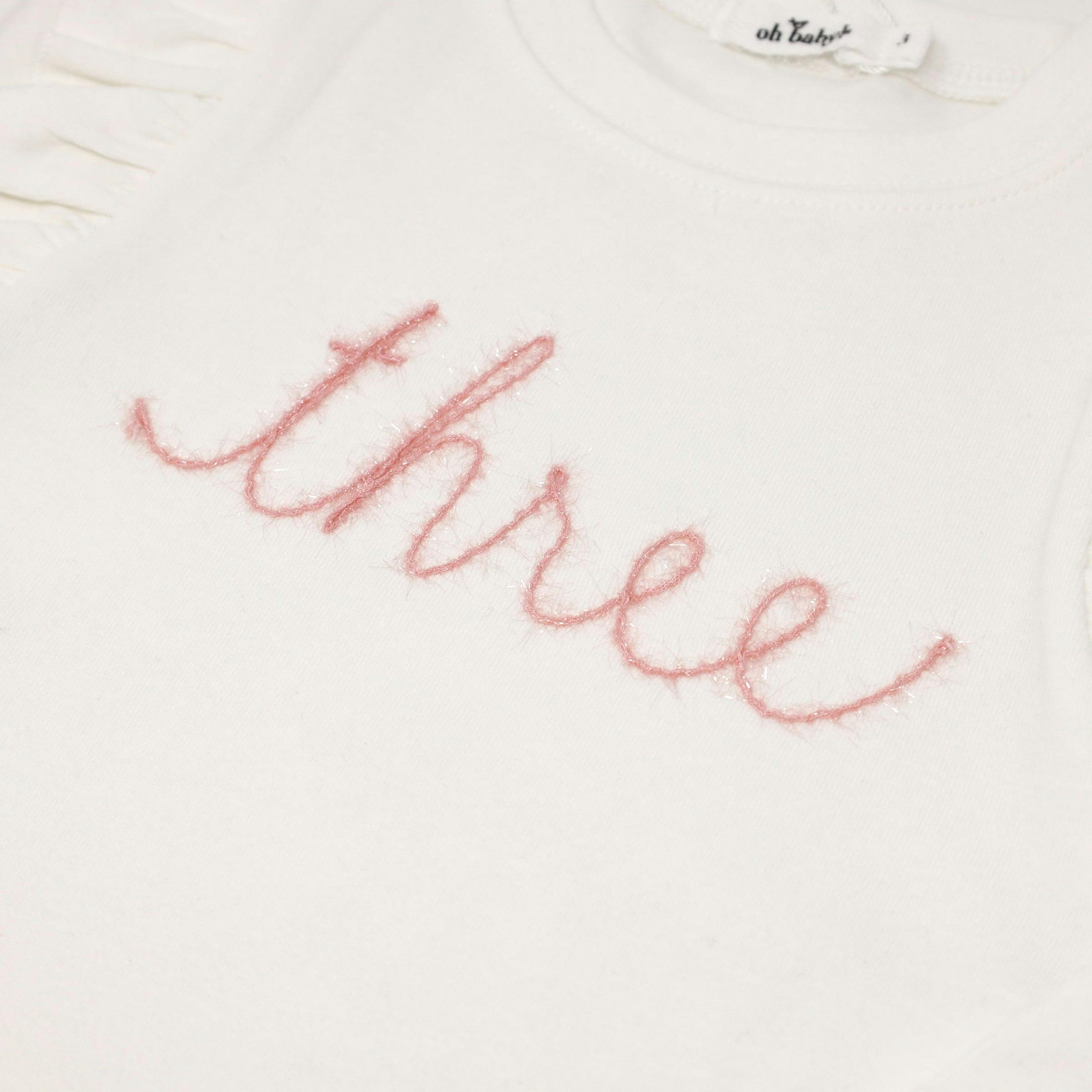 Millie Long Sleeve Tee in 'three' Pink Eyelash Writing