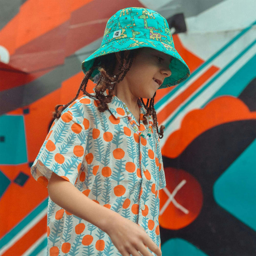 Reversible Adventurer Hat, Giraffe/turquoise