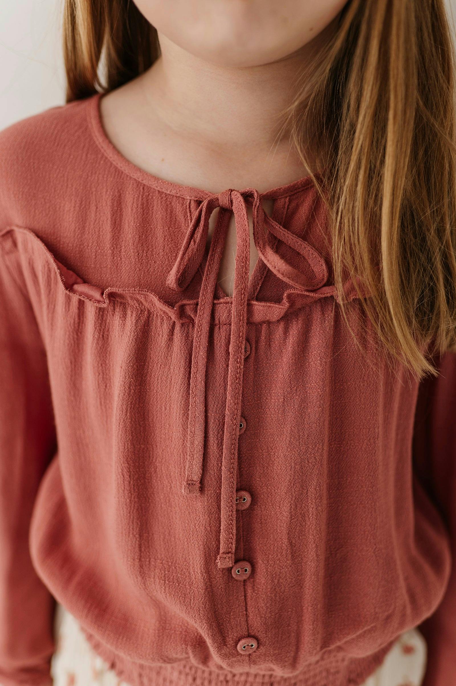 Girls Peasant Blouson Long Sleeve Top in Brick Dust
