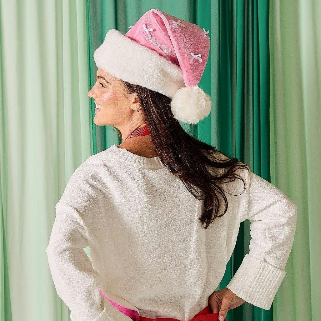 Packed Party Pink Velvet and Bows Santa Hat - Pastel Pink Plush Trim Santa Hat with Festive Bows and Pom Pom for Christmas Parties and Gift Exchanges