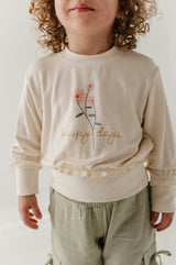 Girls Ruffle Hem Sweatshirt in Happy Days