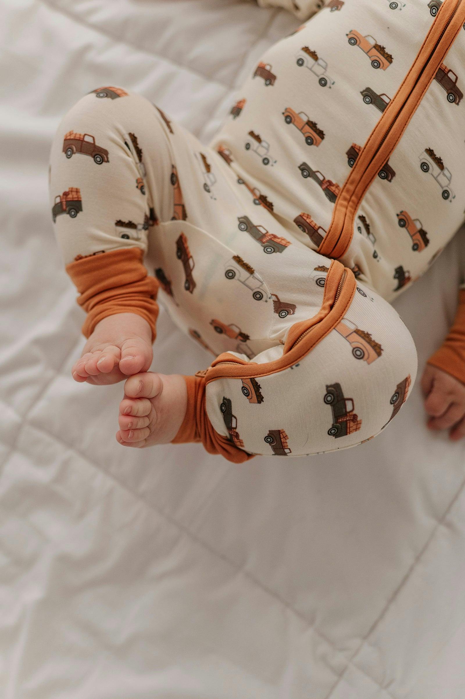Baby Boy Long Sleeve Zip Romper in Pumpkin Trucks