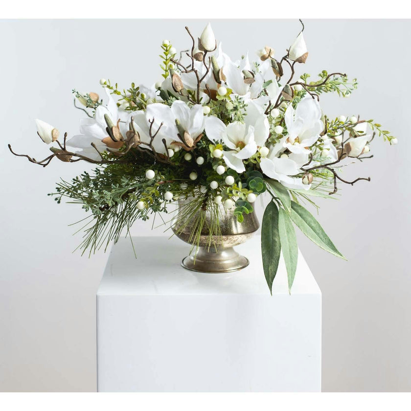 Winter White Magnolia, Pine & Snowberry Christmas Arrangement Centerpiece in Antiqued Silver Metal Urn