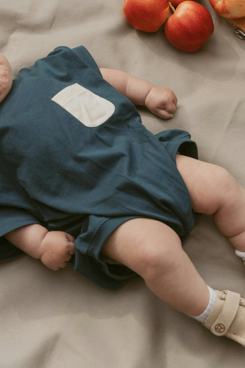 Cory Pocket Romper in Deep Blue