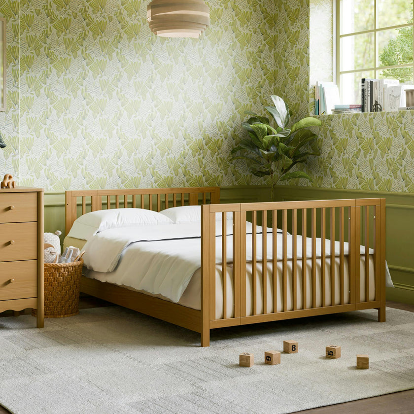 Rolli 9-in-1 Convertible All-Stages® Crib with Bassinet & Toddler Bed Conversion Kits in Honey