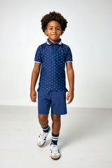 navy polka dot polo shirt