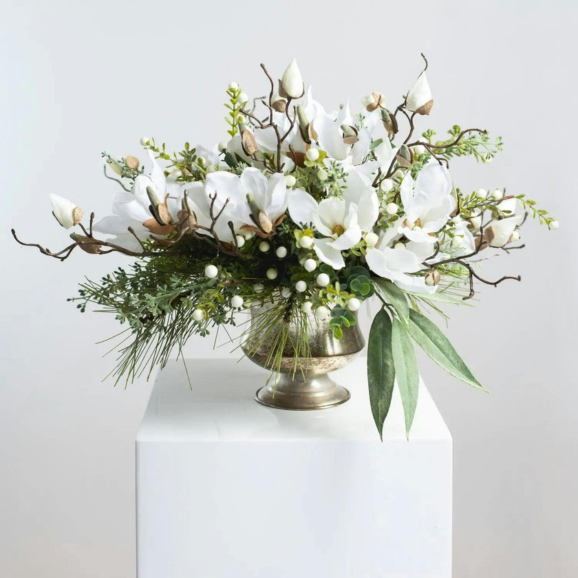 Winter White Magnolia, Pine & Snowberry Christmas Arrangement Centerpiece in Antiqued Silver Metal Urn