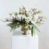Winter White Magnolia, Pine & Snowberry Christmas Arrangement Centerpiece in Antiqued Silver Metal Urn