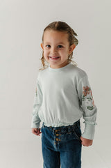 Girls Ruffle Hem Sweatshirt in Floral Sleeves in Misty Blue
