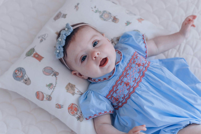 Princess Charlotte Sky Blue Smocked Baby Romper