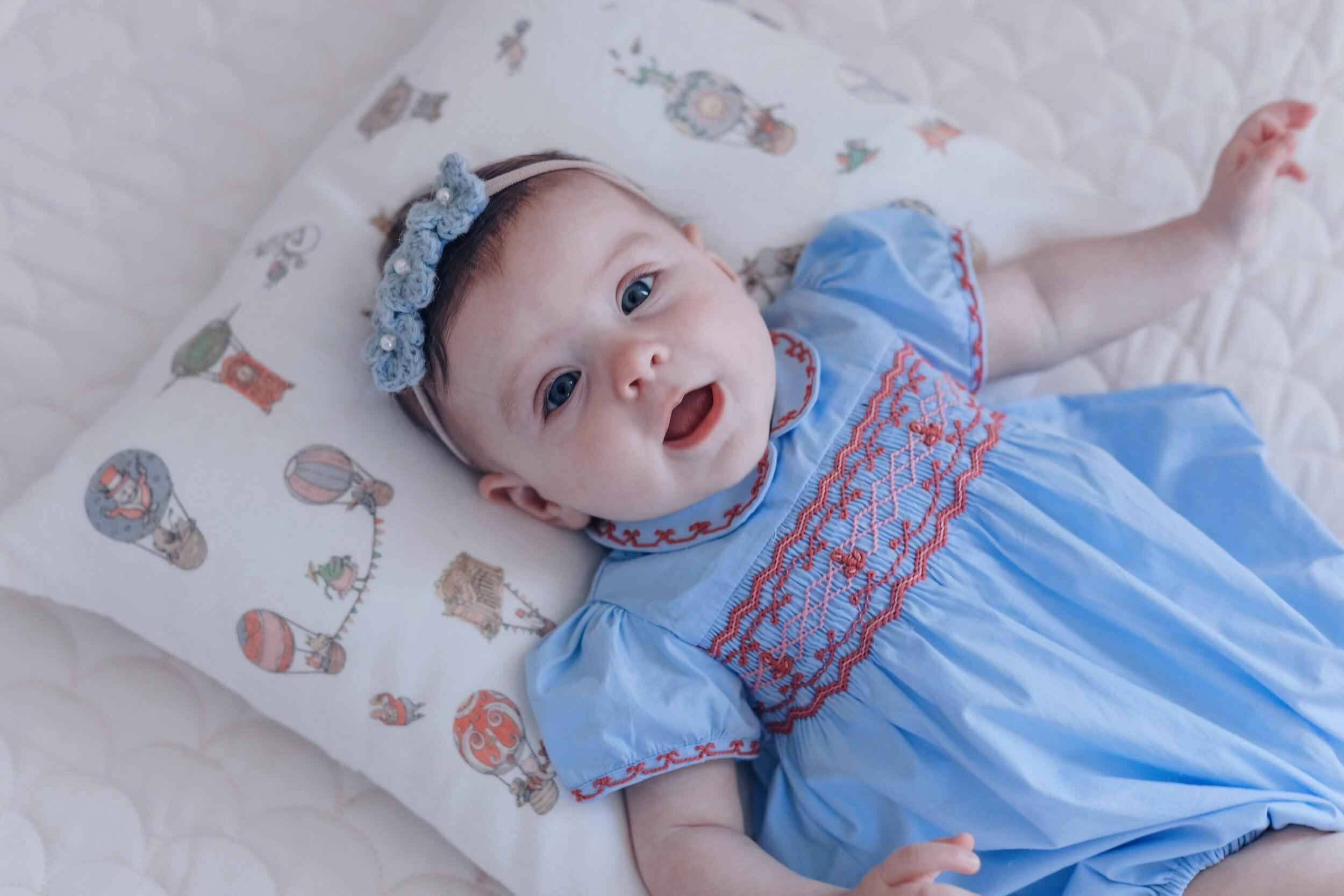 Princess Charlotte Sky Blue Smocked Baby Romper