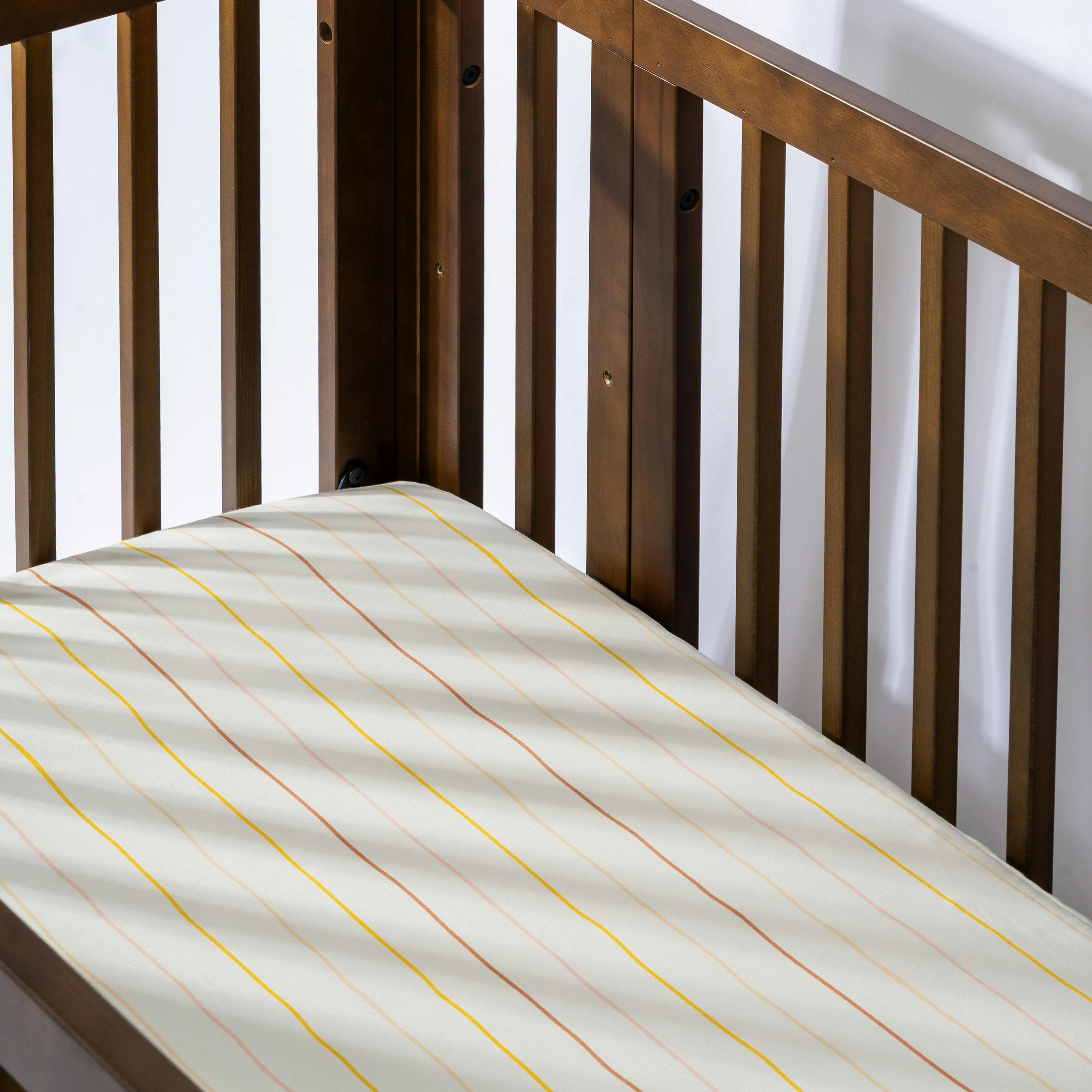 Crib Sheet in GOTS Certified Organic Brushed Cotton in Ivory with Warm Multi-Color Stripes