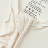 Salt Luxe Solid Ruffle Footed Romper